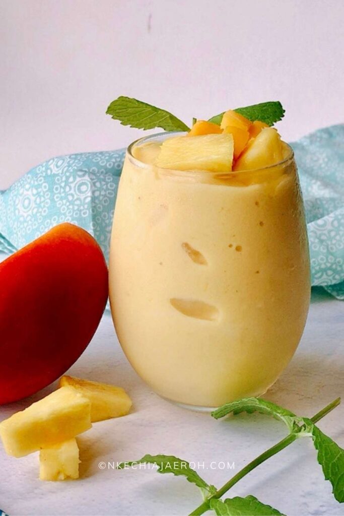This healthy, gluten-free, vegetarian, and easy to make tropical smoothie recipe is an incredible breakfast replacement, made with a blend of tropical fruits you already love and use. This smoothie recipe is can also replace ice cream, and when it does, it is usually called "nice cream." Uniquely, you will be giving your body what it needs. Just like the name suggests, making this smoothie entails using tropical fruits; these are the fruits that mainly grow in tropical countries. Mangoes, pineapples, coconut, papaya are all readily available fruits.