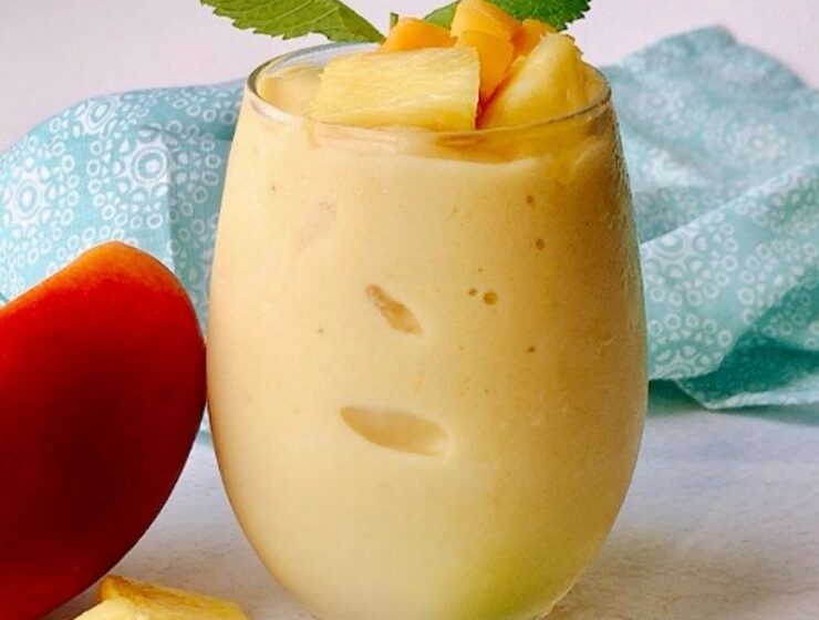 Healthy and nutritious mango pineapple smoothie recipe is refreshing and perfect for those hot days! We call it "nice cream" around here, and the kids love it! This creamy tropical smoothie deliciousness can easily replace your ice cream. To make this vegan mango pineapple smoothie, you will need only five ingredients and a high-speed blender. A thick smoothie by nature, but you can thin it out by adding more liquid. #Tropicalsmoothie #Mangosmoothie #summersmothie #Pineapplesmoothie #nicecream