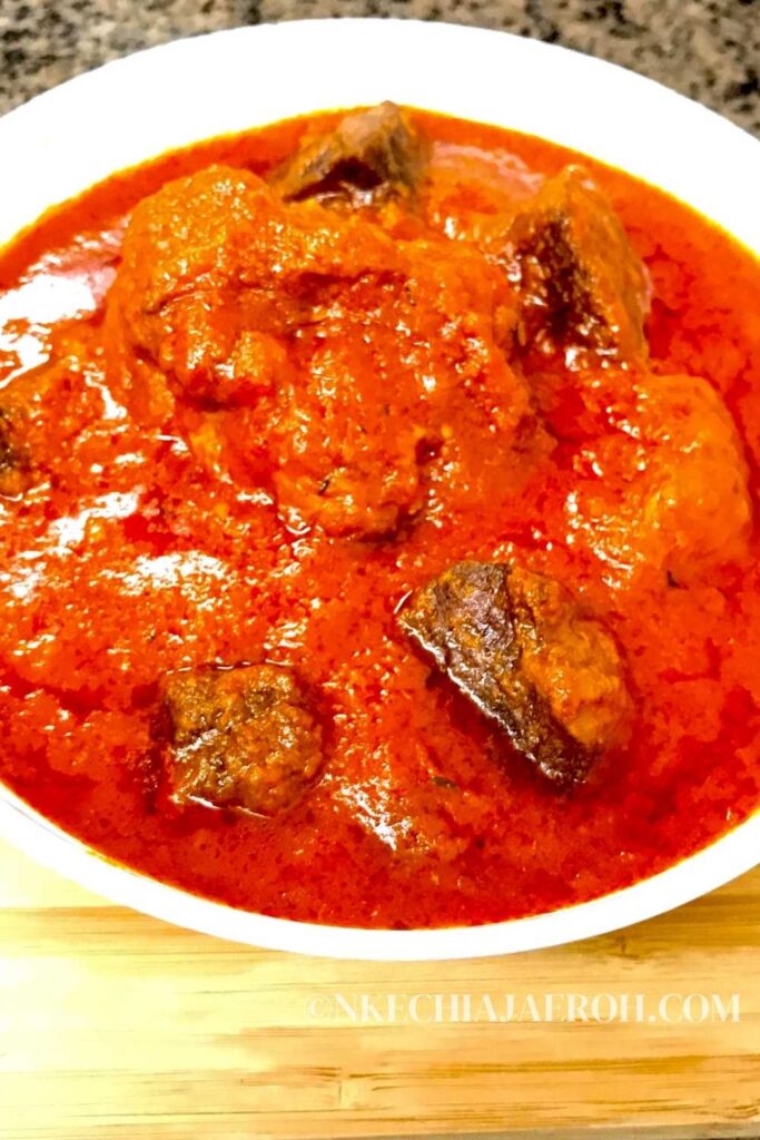 Easy and tasty Nigerian Tomato Stew made with fresh tomatoes, onion, bell peppers, meat, chicken, herbs and seasonings. 