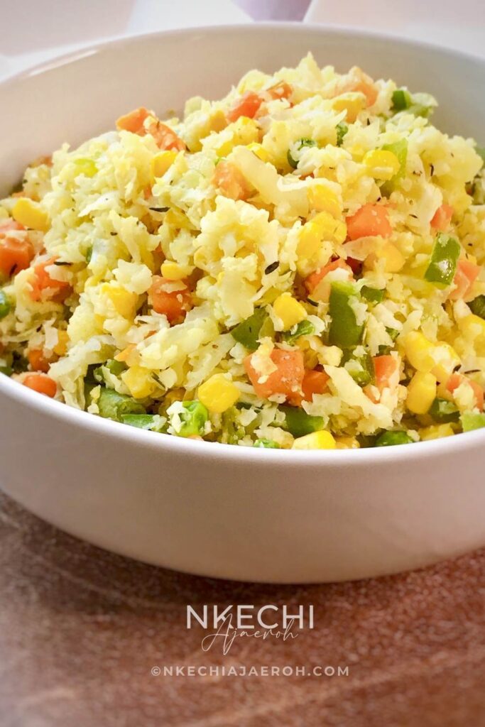 Healthy and delicious Cauliflower fried rice is an easy, low-carb, and keto-friendly version of the famous fried rice recipe! Grab a fresh cauliflower head and shred it using your hand-held shredder or processor. Alternatively, you can buy shredded cauliflower and make this recipe! All you will need for this healthy cauliflower fried rice recipe is shredded cauliflower and vegetables! This healthy dish comes together in less than 20 minutes! And you can serve it with any main dish of choice!