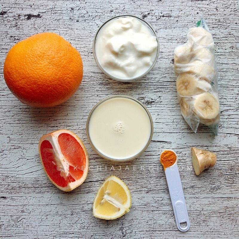 all the ingredients are measured out for the healthy citrus smoothie