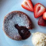 Easy and delicious chocolate lava cake recipe served with ice cream and strawberries