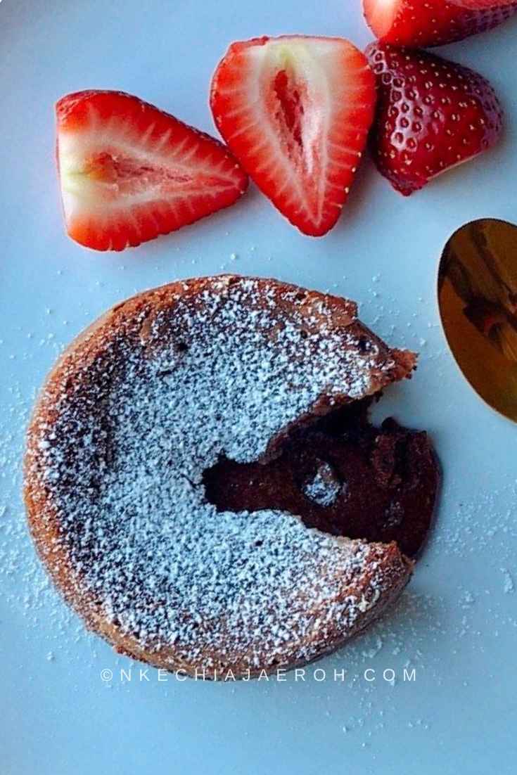 Molten chocolate lava cake with some strawberries