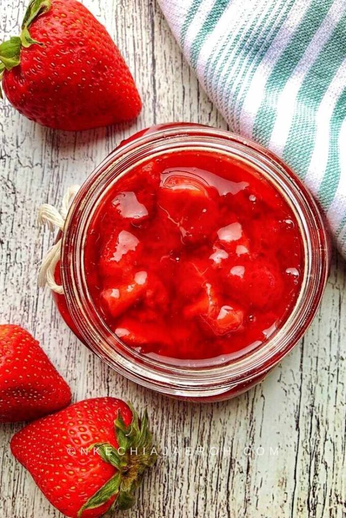 This easy-to-make homemade strawberry sauce recipe is tasty, juicy, and refined sugar-free! This simple fruit sauce is made with fresh strawberries, cornstarch, maple syrup, lemon juice, and lemon zest. It is insanely delicious; you will not miss the refined sugar! This simple strawberry sauce recipe makes an excellent topping for pancakes, waffles, yogurt bowls, cheesecakes, ice cream, and anything you desire! 
