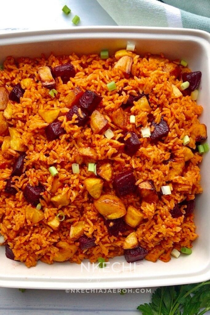 Looking for a healthier way to enjoy jollof rice? This easy brown rice jollof recipe with beets and sweet plantains is packed with flavor, fiber, and wholesome ingredients. A nourishing twist on a Nigerian favorite, this vegan-friendly recipe is perfect for meal prep, weeknight dinners, and anyone who loves healthy comfort food. Save this recipe for later! 🍚✨ #JollofRice #BrownRiceRecipes #HealthyDinnerIdeas #NigerianFood #MealPrepRecipes #HealthyRecipes #PlantainRecipes #AfricanFood #ComfortFood #EasyDinner