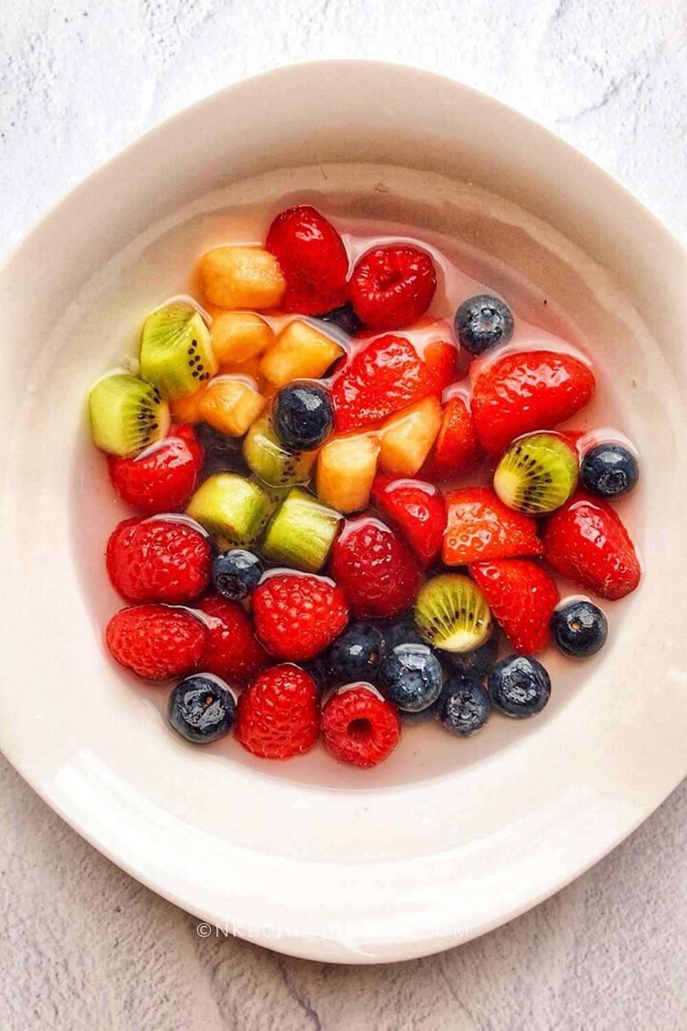 Delight yourself with a bowl of viral TikTok nature's cereal bowl; add your favorite berries and fruits to a bowl, pour some coconut water, ice cubes, and enjoy! You won't believe the refreshing goodness of this fruit cereal! The best thing is that this healthy cereal recipe is easy! #viralnaturescerealvideo #naturescerealrecipe #naturescereal #fruitcereal #fruitbowl #coconutwater