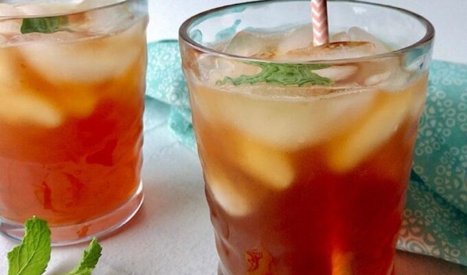 Refreshingly bold and crisp homemade sweet tea recipe made with black tea and a hint of honey and served over ice! Best sweet iced tea.