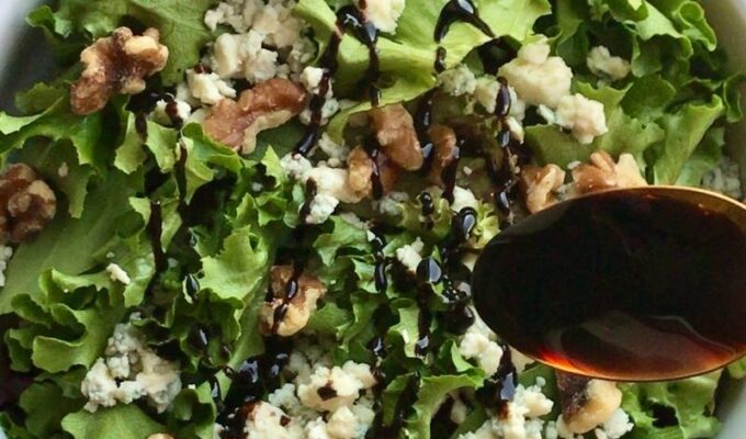 Easy to make and delightfully tasty vegetarian walnut blue cheese salad recipe requires only 4 ingredients. Walnuts, blue cheese, salad greens, and balsamic reduction! This 10-minute salad recipe is the perfect no-cook salad you need for the summer months and beyond! You can use this salad for lunch/dinner or as a side dish! Walnut blue cheese salad is a refreshingly light salad that is salty, sweet, and satisfying! Feel free to add your choice of protein for an enjoyable and comforting meal!