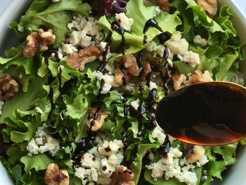 Easy to make and delightfully tasty vegetarian walnut blue cheese salad recipe requires only 4 ingredients. Walnuts, blue cheese, salad greens, and balsamic reduction! This 10-minute salad recipe is the perfect no-cook salad you need for the summer months and beyond! You can use this salad for lunch/dinner or as a side dish! Walnut blue cheese salad is a refreshingly light salad that is salty, sweet, and satisfying! Feel free to add your choice of protein for an enjoyable and comforting meal!