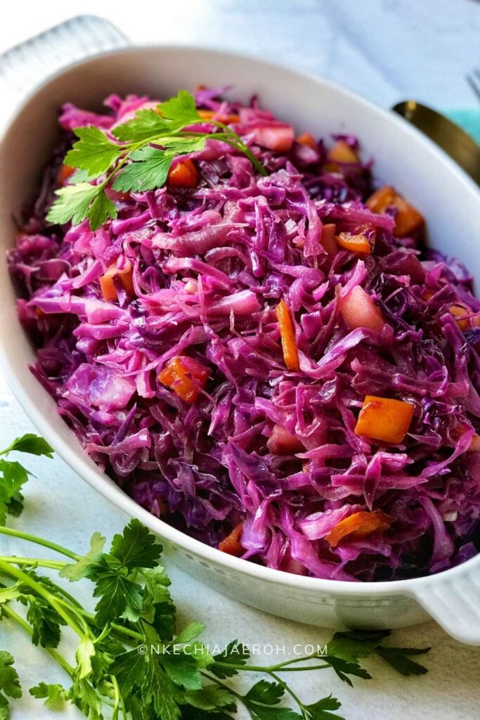 Super easy healthy braised red cabbage with apples and red onions is the best side dish ever! It's savory, sweet, a little sour, tangy, and wonderfully complements every main dish. This recipe is vegan, gluten-free, refined sugar-free, keto – friendly and packed with flavorful herbs and spices. Look no further for a fabulous + tasty, healthy side you need for the holidays especially Thanksgiving and Christmas. Also, it comes together so quickly! #Cabbage #Braisedcabbage #healthysidedish #side