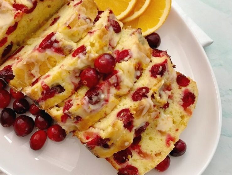 Easy cranberry orange bread with orange glaze is moist, tasty, flavorful, colorful and sharp. It has the right amount of tart from the fresh cranberries, the sweetness of the orange juice, and flavors from the zest. Cranberry loaf bread is perfect for dessert, breakfast, or brunch! Easy cranberry bread is surely the way to go during the holidays! #Cranberries #cranberryseason #holidaybaking #Cranberrybread #orangebread #cranberryorangebread #Christmasdessert