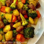 Easy, mouth-watering air fryer potatoes, sausage, carrots, and broccoli meal is the perfect lunch or dinner any day! The sausage and vegetables are perfectly crisp on the outside, tender on the inside, flavorful, and satisfyingly delicious. Air fried potatoes and sausage are ideal for the entire family to enjoy on those busy weekday/weekend lunches or dinners. This recipe is kids-approved. It comes through quickly as making a complete meal in the air fryer is easy peasy! #airfryerrecipe #airfryerrecipes #airfryersausage #airfryerdinner #easydinnerrecipes #easylunchrecipes #sausageandpotatoes #airfryerpotatoes #airfriedmeal