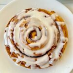 The air fryer giant cinnamon roll is perfect for a weekend breakfast; it is delightful, fun, easy to make, and gorgeous! All you need to make this huge cinnamon roll is a can of Pillsbury deluxe cinnamon rolls and your air fryer. I really love the idea of a cake-looking cinnamon roll. And the best part is that making extra-large cinnamon rolls in the air fryer requires only one ingredient! #Giantcinnamonroll #extralargecinnamonroll #cinnamonrolls #airfryercinnamonroll #airfryerrolls