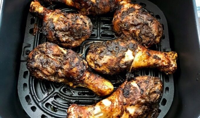 The most flavorful, lips-smacking jerk chicken drumsticks are marinated in jerk seasoning and cooked in the air fryer. They are crispy on the outside, moist, and tender on the inside. These air fryer jerk chicken legs are spicy (obviously, from the jerk marinade), tasty, easy to make, and great for meal prep. These keto air fried jerk chicken legs are hot, spicy, and flavorful! Easily make jerk chicken drumsticks in air fryer with jerk seasoning. #jerk #jerkchicken #Jerkchickendrumsticks #chickendrumsticks #Chickenrecipe