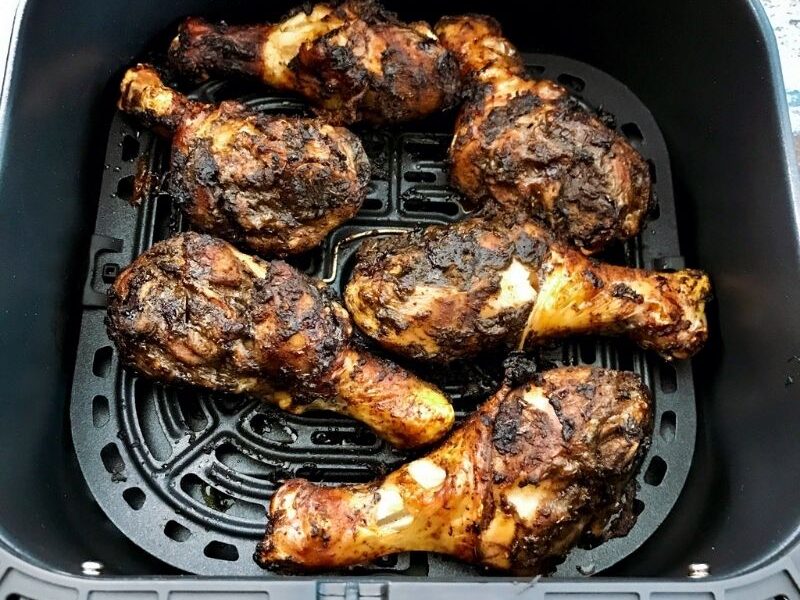 The most flavorful, lips-smacking jerk chicken drumsticks are marinated in jerk seasoning and cooked in the air fryer. They are crispy on the outside, moist, and tender on the inside. These air fryer jerk chicken legs are spicy (obviously, from the jerk marinade), tasty, easy to make, and great for meal prep. These keto air fried jerk chicken legs are hot, spicy, and flavorful! Easily make jerk chicken drumsticks in air fryer with jerk seasoning. #jerk #jerkchicken #Jerkchickendrumsticks #chickendrumsticks #Chickenrecipe