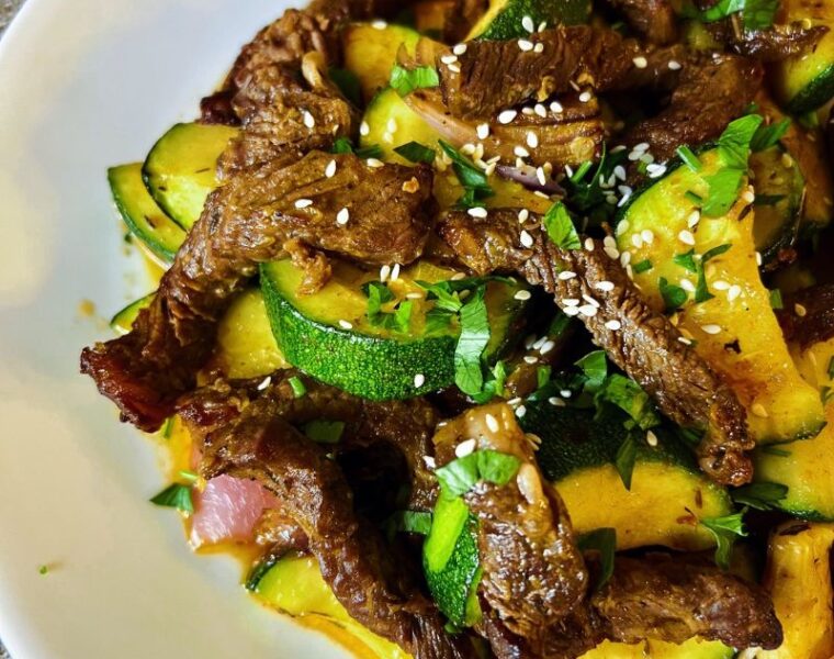 An easy air fryer ribeye steak and zucchini (stir-fry) is a healthy low-carb meal you can easily make in the air fryer. When you air fry a ribeye steak, you end up with a juicy, tasty + satisfying piece of meat. Steak and zucchini stir-fry in the air fryer guarantees you a healthy quick, and easy lunch or dinner. Air-fried ribeye steak and zucchini meal is gluten-free, dairy-free, whole30, low-carb, and keto. #stea #airfryersteak #lowcarb #zucchini #stirfry