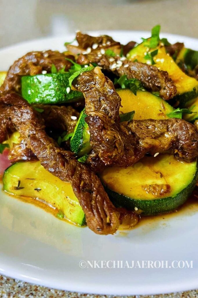 An easy air fryer ribeye steak and zucchini (stir-fry) is a healthy low-carb meal you can easily make in the air fryer. When you air fry a ribeye steak, you end up with a juicy, tasty + satisfying piece of meat. Steak and zucchini stir-fry in the air fryer guarantees you a healthy quick, and easy lunch or dinner. Air-fried ribeye steak and zucchini meal is gluten-free, dairy-free, whole30, low-carb, and keto. #stea #airfryersteak #lowcarb #zucchini #stirfry