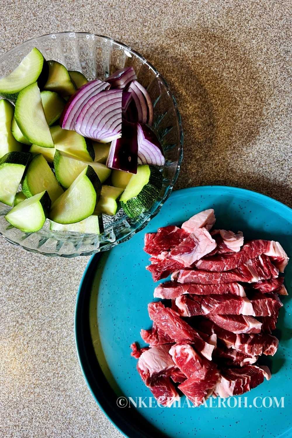 cut zucchini and sliced steak