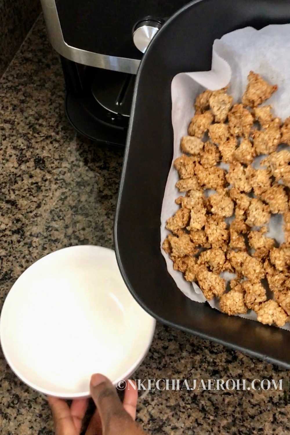 Easy recipe for healthy banana oat granola clusters in the air fryer! This chunky granola is vegan, gluten-free, and refined sugar-free, and they come together so quickly in your air fryer! Homemade granola clusters are healthier and better than anything you can buy. Banana granola has no preservatives, refined sugar, or artificial ingredients. It is also dairy-free! Simply combine overripe banana and oat to make these healthy chunky granolas in your air fryer! #bananagranola #chunkygranola #airfryergranola #granolarecipe