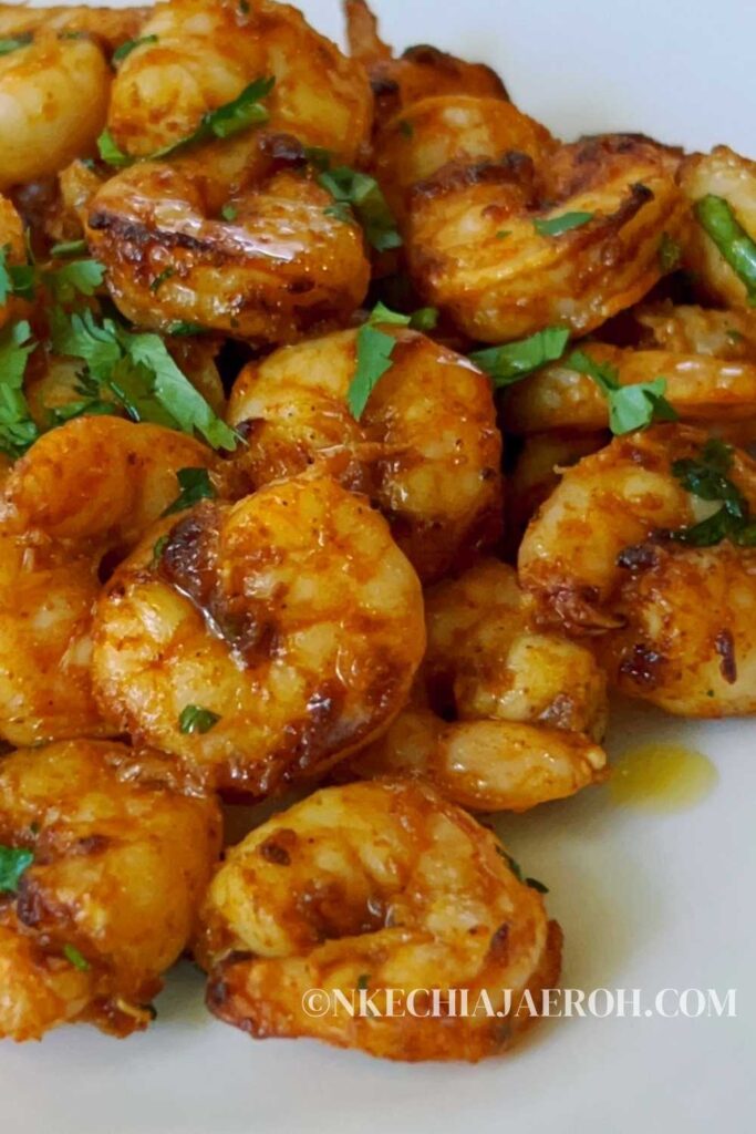 A simple recipe of garlic butter shrimp cooked in the air fryer is buttery, flavorful, and satisfyingly delicious! All you need is a few ingredients alongside fresh garlic and a good quality butter. Then season the shrimp with the ingredients and melted butter, and simply air fry for less than 10 minutes. Air fryer garlic butter shrimp is the perfect weeknight or weekday recipe everyone will swoon over! This garlic butter shrimp is an excellent keto meal with low carbohydrate and high protein. #Airfryershrimp #Garlicbuttershrimp #Shrimprecipe #Airfryerseafood #airfryerrecipes 