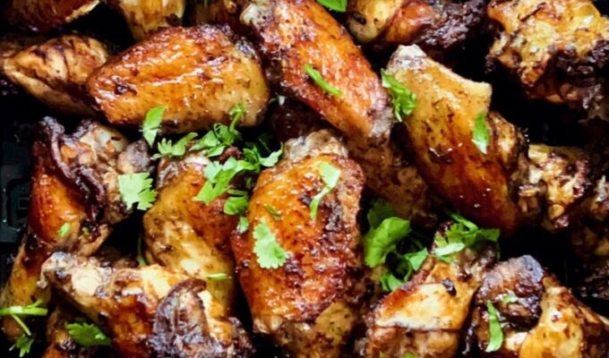 Easy air fryer jerk chicken wings are smoky, spicy, flavorful, and tasty! Crispy on the outside and yet tender and juicy inside. You will be licking every drop of seasoning off your fingers and will never get tired of eating these jerk-seasoned chicken wings. If you are looking for the perfect party dish, these air-fried Jamaican jerk chicken wings are it! #airfryerjerkchicken #jerkchicken #airfriedjerkchicken #chickenwings #jerkmarinade