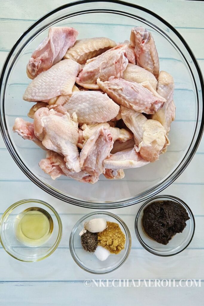Ingredients for making jerk chicken wings include chicken wings, jerk marinade, avocado oil, garlic powder, dry thyme and salt