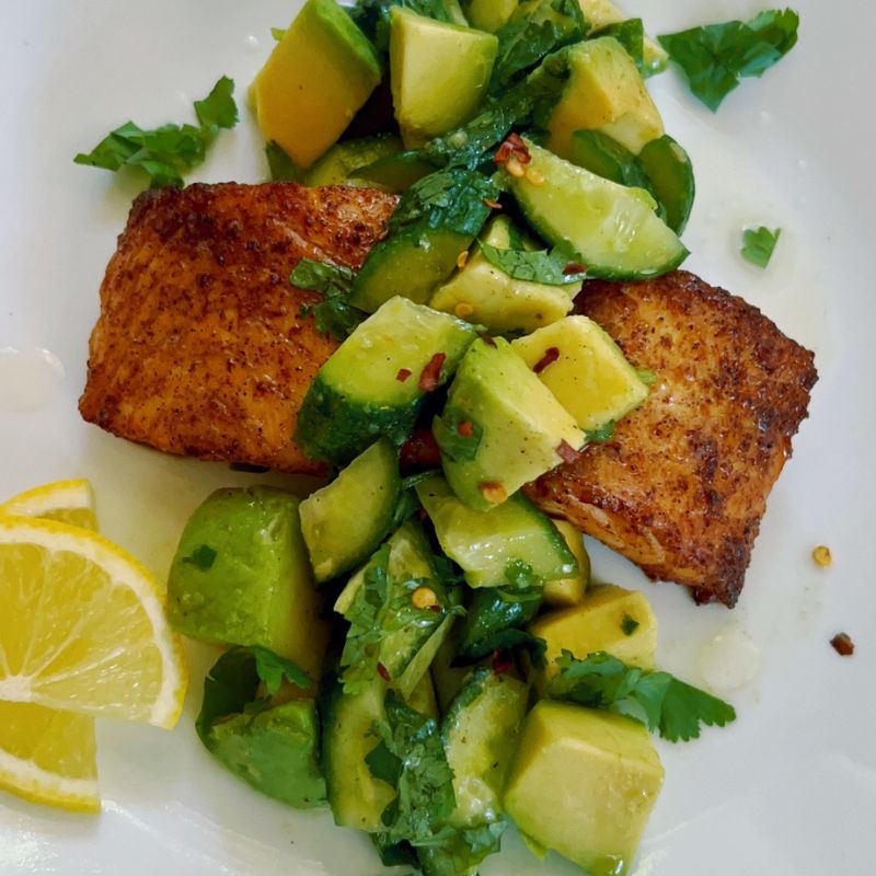 Cajun Air Fryer Salmon with Avocado Salsa takes less than 20 minutes and is healthy and super-delicious! To make this easy salmon salad recipe, you will need salmon and an air fryer. Make the avocado salsa with ripe avocado, baby English cucumber, olive oil, freshly squeezed lemon juice, cilantro, salt, and pepper. Hands down, the best air fryer salmon recipe with avocado salad for just one person!