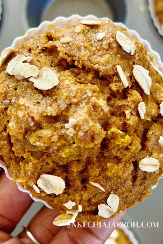 These easy-to-make whole wheat pumpkin muffins with oats are fluffy, moist, pliable, and packed with healthy nutrients! Whole wheat pumpkin muffins require only simple ingredients such as whole wheat flour, oats, pumpkin purée, almond milk, warm fall spices, etc. Perfect fall/autumn season treat your entire family will enjoy. #Pumpkins #Pumpkinmuffins #Fall #Autumn #Pumpkinseason #breakfastmuffin 