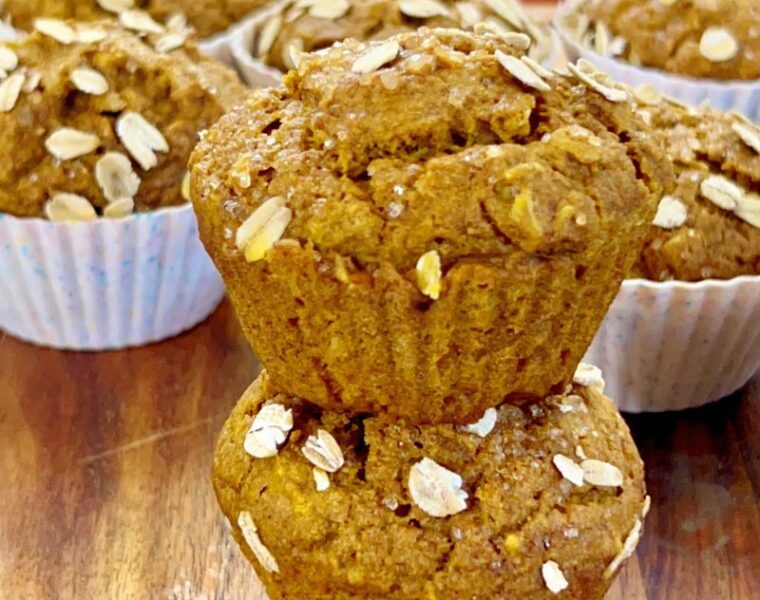 These easy-to-make whole wheat pumpkin muffins with oats are fluffy, moist, pliable, and packed with healthy nutrients! Whole wheat pumpkin muffins require only simple ingredients such as whole wheat flour, oats, pumpkin purée, almond milk, warm fall spices, etc. Perfect fall/autumn season treat your entire family will enjoy. #Pumpkins #Pumpkinmuffins #Fall #Autumn #Pumpkinseason #breakfastmuffin