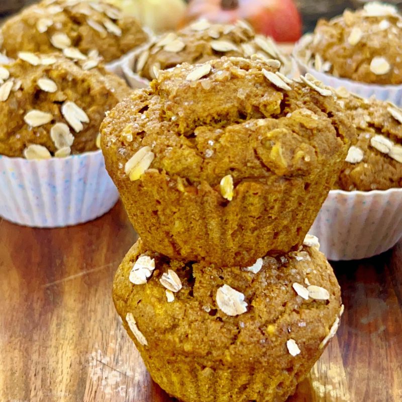 These easy-to-make whole wheat pumpkin muffins with oats are fluffy, moist, pliable, and packed with healthy nutrients! Whole wheat pumpkin muffins require only simple ingredients such as whole wheat flour, oats, pumpkin purée, almond milk, warm fall spices, etc. Perfect fall/autumn season treat your entire family will enjoy. #Pumpkins #Pumpkinmuffins #Fall #Autumn #Pumpkinseason #breakfastmuffin