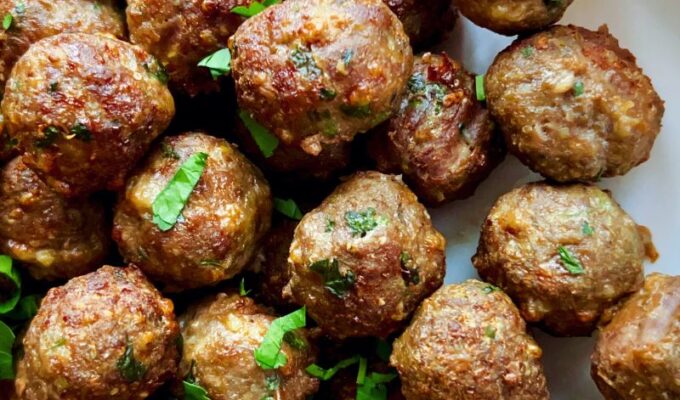 These juicy air fryer meatballs from scratch with parsley are simply the best meatball recipe you can find anywhere! Making meatballs from scratch in the air fryer saves time, energy, and calories! Then you will end up with healthy meatballs that are super tasty, juicy, tender, easily freezable, and a crowd-pleaser. Say no to store-bought meatballs; easily make your meatball recipe with healthier ingredients and freeze them afterward. Add these meatballs to marinara sauce and serve with spaghetti and any pasta of choice. #Meatballs #Airfryermeatballs #airfreyrecipes #dinnerrecipe #easymeals