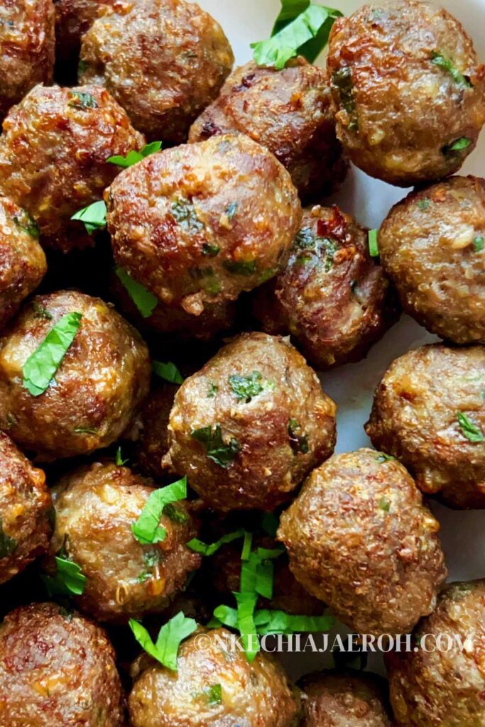 These juicy air fryer meatballs from scratch with parsley are simply the best meatball recipe you can find anywhere! Making meatballs from scratch in the air fryer saves time, energy, and calories! Then you will end up with healthy meatballs that are super tasty, juicy, tender, easily freezable, and a crowd-pleaser. Say no to store-bought meatballs; easily make your meatball recipe with healthier ingredients and freeze them afterward. Add these meatballs to marinara sauce and serve with spaghetti and any pasta of choice. #Meatballs #Airfryermeatballs #airfreyrecipes #dinnerrecipe #easymeals