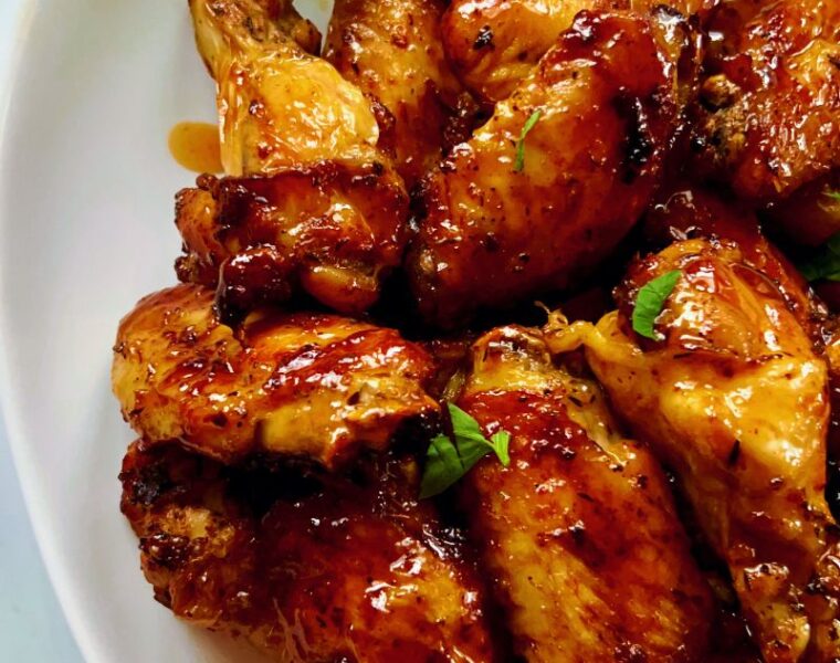 Spicy and sweet, these air fryer hot honey chicken wings are hot, spicy, sticky, and tasty! The hot and sweet combination of hot sauce and hot honey is a surefire win for wing fanatics—a perfect favorite way to cook and enjoy chicken wings. The air fryer gives the wings a perfectly crispy exterior yet a juicy, tender inside. Hot honey butter chicken wings are great for appetizers, potlucks, parties, picnics, and family lunches/dinners. #Chickenwings #Hothoney #Chickenrecipes