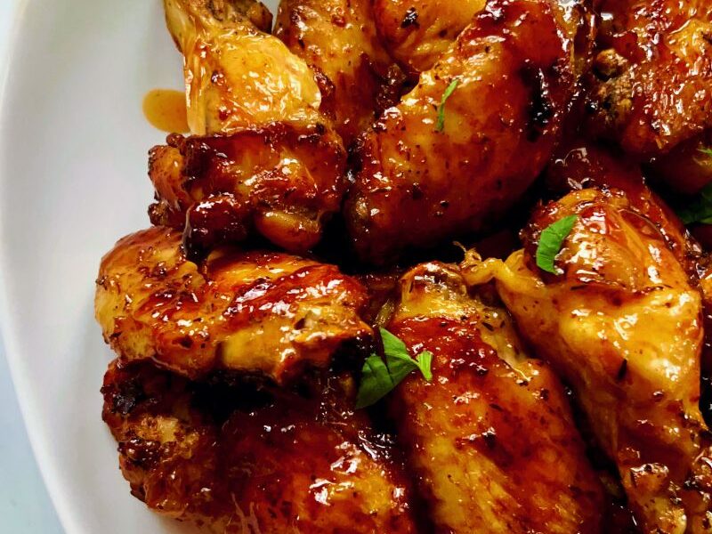 Spicy and sweet, these air fryer hot honey chicken wings are hot, spicy, sticky, and tasty! The hot and sweet combination of hot sauce and hot honey is a surefire win for wing fanatics—a perfect favorite way to cook and enjoy chicken wings. The air fryer gives the wings a perfectly crispy exterior yet a juicy, tender inside. Hot honey butter chicken wings are great for appetizers, potlucks, parties, picnics, and family lunches/dinners. #Chickenwings #Hothoney #Chickenrecipes