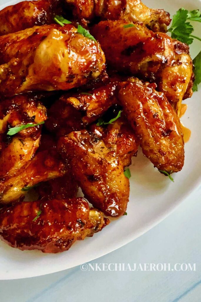 Spicy and sweet, these air fryer hot honey chicken wings are hot, spicy, sticky, and tasty! The hot and sweet combination of hot sauce and hot honey is a surefire win for wing fanatics—a perfect favorite way to cook and enjoy chicken wings. The air fryer gives the wings a perfectly crispy exterior yet a juicy, tender inside. Hot honey butter chicken wings are great for appetizers, potlucks, parties, picnics, and family lunches/dinners. #Chickenwings #Hothoney #Chickenrecipes