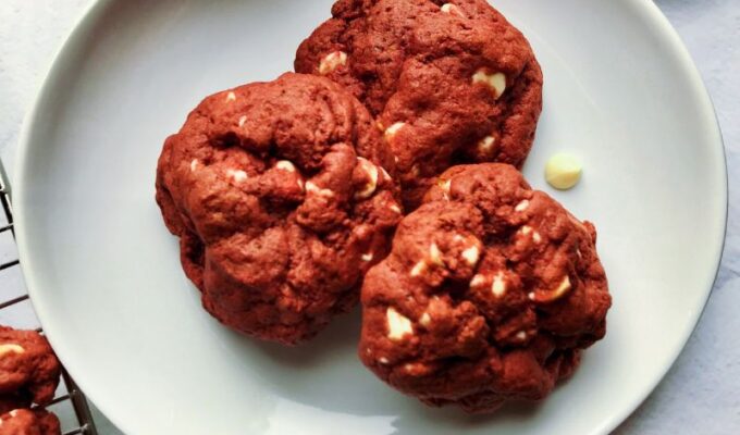 These bright red-colored cookies with white chocolate chips and no artificial coloring will become your go-to red velvet cookie recipe. Tasty, healthy red velvet cookies with beets taste exactly like the classic red velvet cake but in cookies. They are very delicious without any taste of the earthy beets! These are the perfect chewy and soft cookies with melty white chocolate chips—the best classic red velvet cake in cookie form.