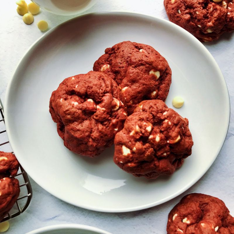 These bright red-colored cookies with white chocolate chips and no artificial coloring will become your go-to red velvet cookie recipe. Tasty, healthy red velvet cookies with beets taste exactly like the classic red velvet cake but in cookies. They are very delicious without any taste of the earthy beets! These are the perfect chewy and soft cookies with melty white chocolate chips—the best classic red velvet cake in cookie form.