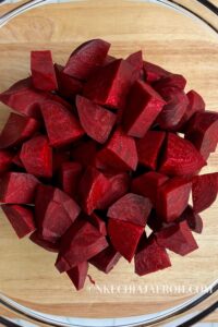 Your first step is to wash, peel, and cut the beetroot. Keep your chunks of beets around the same size for even cooking.