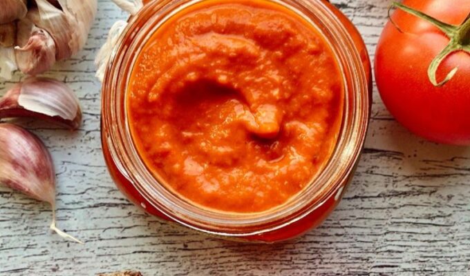Roasted Tomatoes and Peppers Pizza Sauce! A smoky, savory, fiery, tasty homemade pizza sauce made with (fresh) roasted ingredients will instantly transform your pizza to gourmet quality! With this pizza sauce recipe, we make everything from scratch! This homemade pizza sauce recipe comprises selecting the freshest tomatoes, bell peppers, onions, and garlic! Then charring/roasting the vegetables to move the flavor level from 0 - 1000! Nothing is better on your homemade pizza than roasted tomatoes and peppers pizza sauce! The best thing about this homemade pizza sauce is that you can use it as a savory dip or topping on anything! Also, this pizza sauce is low-carb, gluten-free, and vegan!
