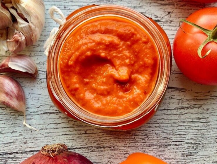 Roasted Tomatoes and Peppers Pizza Sauce! A smoky, savory, fiery, tasty homemade pizza sauce made with (fresh) roasted ingredients will instantly transform your pizza to gourmet quality! With this pizza sauce recipe, we make everything from scratch! This homemade pizza sauce recipe comprises selecting the freshest tomatoes, bell peppers, onions, and garlic! Then charring/roasting the vegetables to move the flavor level from 0 - 1000! Nothing is better on your homemade pizza than roasted tomatoes and peppers pizza sauce! The best thing about this homemade pizza sauce is that you can use it as a savory dip or topping on anything! Also, this pizza sauce is low-carb, gluten-free, and vegan!