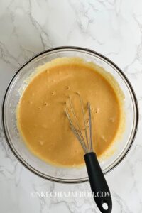 Add all the wet ingredients (pumpkin puree, milk, yogurt, eggs, maple syrup, butter, and vanilla extract) into a bowl, then use a whisk to combine.