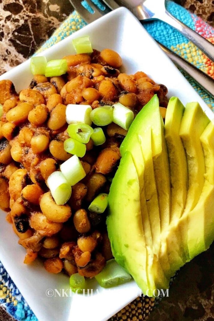 Super easy to make Nigerian beans recipe served with avocado