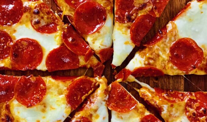 An easy recipe of homemade thin crust pizza is quick to make, healthier, has fewer calories, and is perfect for family pizza night! Thin crust pizza is also called slim/skinny pizza! If you are ready to enjoy a wholesome pizza without a hefty calorie price and yet with all the flavors and ingredients, a thin-crust pizza recipe is what you need. Homemade thin crust pizza recipe has an excellent carbohydrate-protein-fat ratio, unlike thick crust/deep dish pizzas. Pizzas have bad wraps, but not this thin crust pizza! Unlike those bulky, thick pizza slices, the thin/skinny crust pizza is light, flaky, and enjoyable.