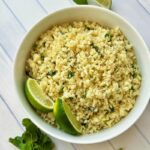 For a healthy side dish with loads of flavor, turn to cauliflower rice. Seasoned with cilantro and lime, it's refreshing, filling, and utterly delicious. Cilantro lime cauliflower rice is perfect for when you're trying to stick to those resolutions or simply trying to work more veggies into your meals! If you are currently on a low-carb diet or thinking about it, this cauliflower rice will be suitable for you. Versatile and perfect for meal prepping. You can cook your cauliflower cilantro lime rice at the start of the week and then have it on hand during the week. Amazingly, this recipe caters to most of the diet preferences as it is gluten-free, vegan, paleo-friendly, keto, whole30, and dairy-free!