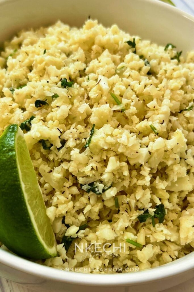 For a healthy side dish with loads of flavor, turn to cauliflower rice. Seasoned with cilantro and lime, it's refreshing, filling, and utterly delicious. Cilantro lime cauliflower rice is perfect for when you're trying to stick to those resolutions or simply trying to work more veggies into your meals! If you are currently on a low-carb diet or thinking about it, this cauliflower rice will be suitable for you. Versatile and perfect for meal prepping. You can cook your cauliflower cilantro lime rice at the start of the week and then have it on hand during the week. Amazingly, this recipe caters to most of the diet preferences as it is gluten-free, vegan, paleo-friendly, keto, whole30,  and dairy-free!  