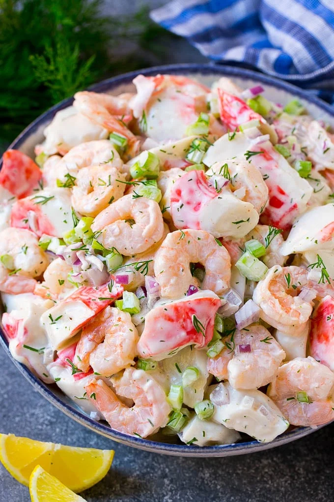 This seafood salad is a blend of imitation crab and shrimp in a creamy dill dressing with fresh vegetables. An easy high-protein lunch option that takes just minutes to make! 