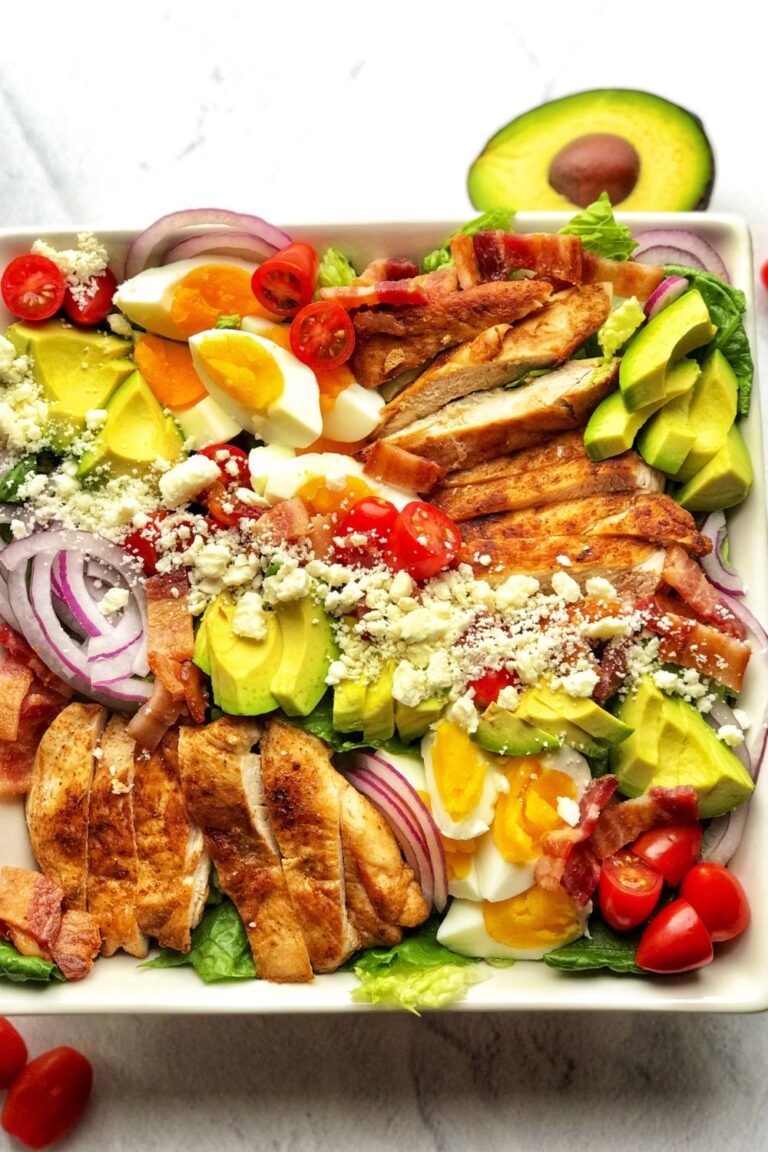 Healthy and delicious keto cobb salad is low-calorie (low-carb, obviously), gluten-free, very tasty, and full of flavors. This salad is made with fresh romaine lettuce, sautéed chicken breast, crispy bacon, hard-boiled eggs, cherry tomatoes, avocado, and crumbled feta cheese. The best thing about this cobb salad is it can be prepped ahead, which means it comes together quickly whenever you want to eat it! This is the low-carb meal prep salad recipe you are looking for; easy, breezy, and tasty! Definitely a must-try!