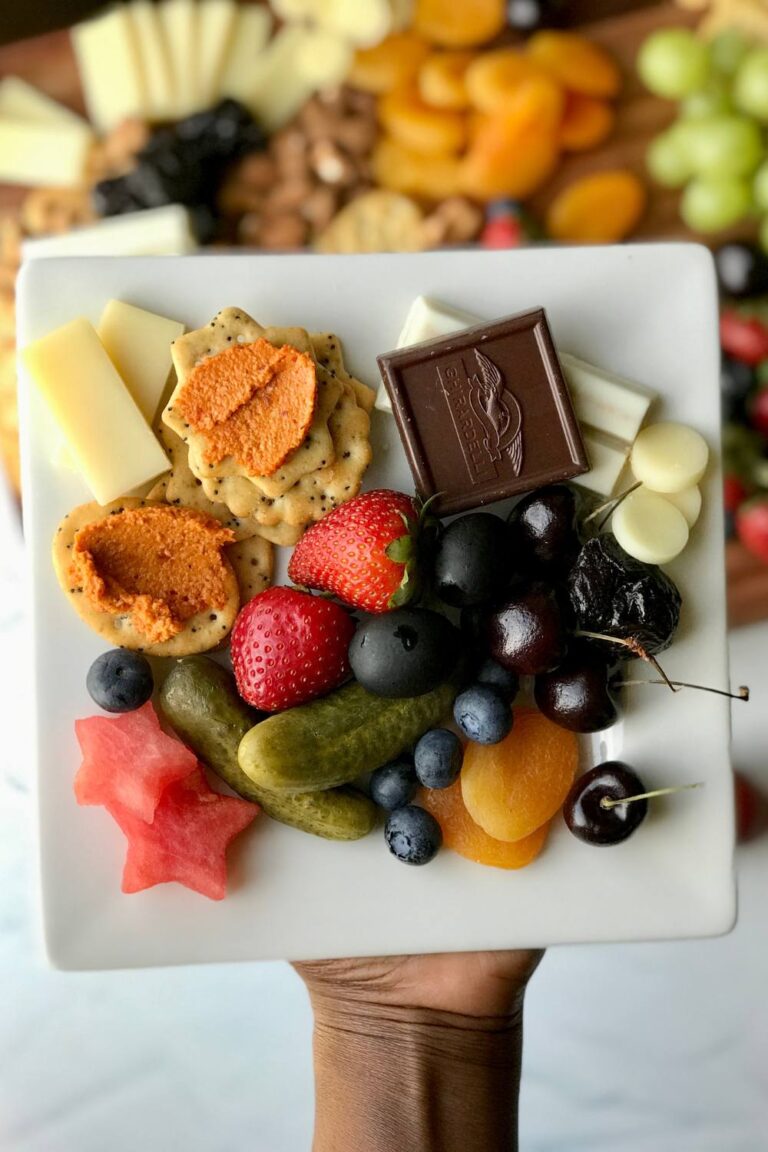 Easy to make healthy charcuterie board is vegetarian (no meat) and more nutritious than most cheese boards. Packed with summer fruits, brined veggies, dried fruits, and nuts, this is the only vegetarian charcuterie board recipe you will ever need! 