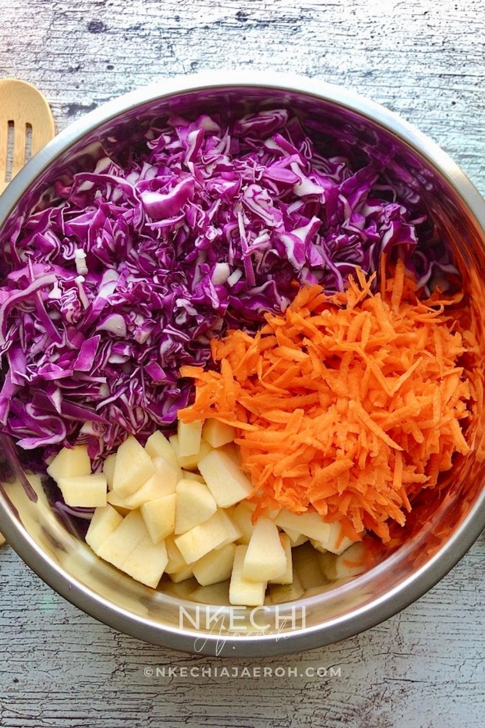 Here's the easiest and tastiest cabbage carrot apple salad you and your family will enjoy! Everyone needs that quick go-to salad that is perfect at any time of the year and can go with anything! Today, I want to share my cabbage carrot apple slaw. This easy red cabbage salad recipe requires only three main ingredients, namely red or purple cabbage, carrots, and apple, and then you add the dressing. And you are left with a tasty, refreshing light salad! This super easy and nutritious red/purple cabbage salad is the perfect effortless side dish that will go with any main dish.