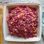 Here's the easiest and tastiest cabbage carrot apple salad you and your family will enjoy! Everyone needs that quick go-to salad that is perfect at any time of the year and can go with anything! Today, I want to share my cabbage carrot apple slaw. This easy red cabbage salad recipe requires only three main ingredients, namely red or purple cabbage, carrots, and apple, and then you add the dressing. And you are left with a tasty, refreshing light salad! This super easy and nutritious red/purple cabbage salad is the perfect effortless side dish that will go with any main dish.